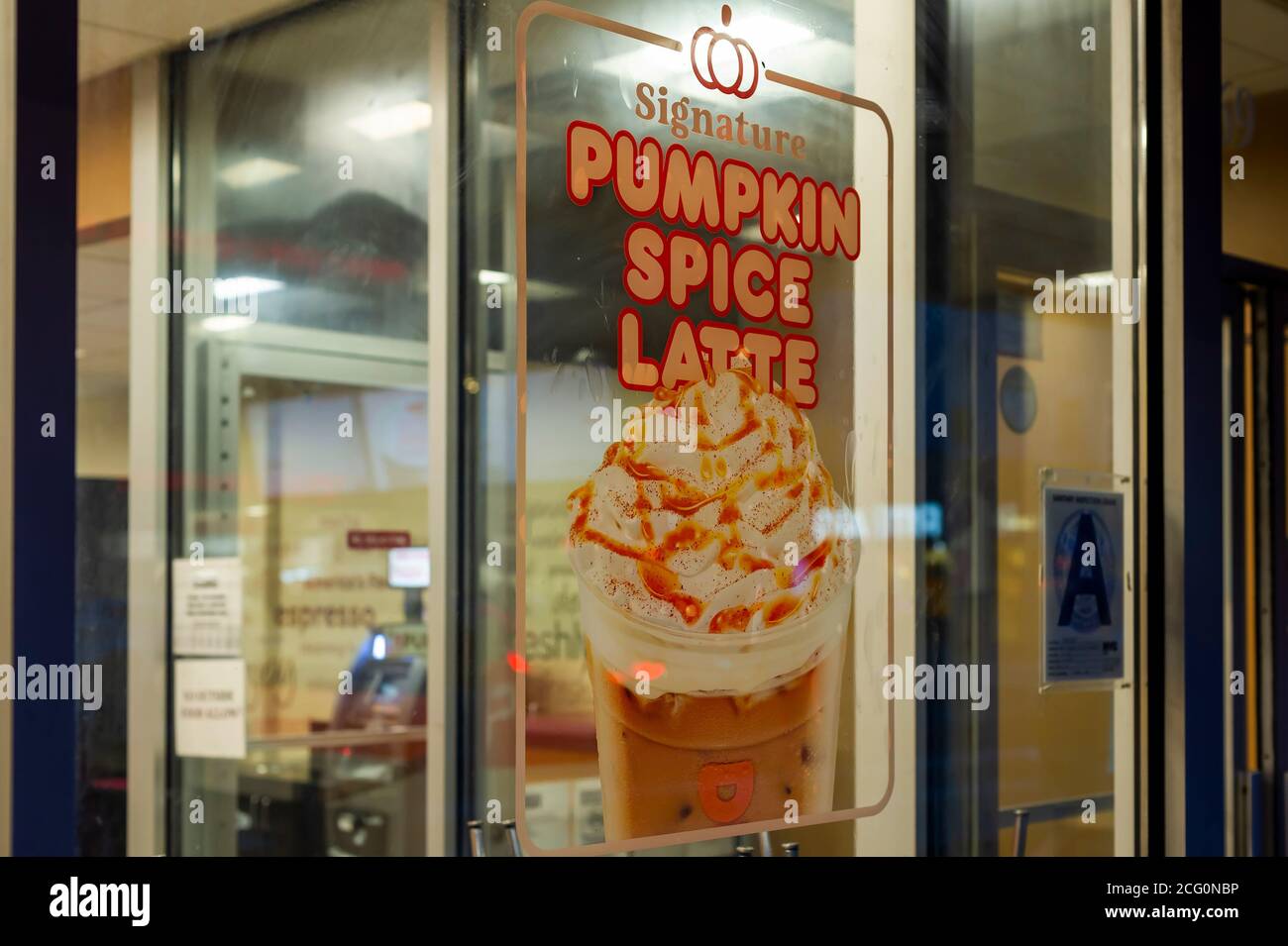 A Sign On The Window Of A Dunkin Donuts In New York Advertises The Availability Of