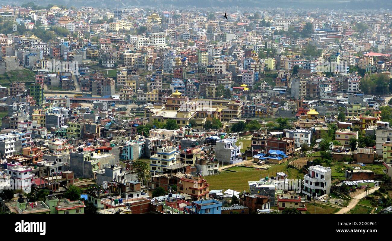 Aerial view on Kathmandu, capital of highland Nepal, located in scenic valley of Kathmandu. Town is famous for its amazing architecture and temples. Stock Photo