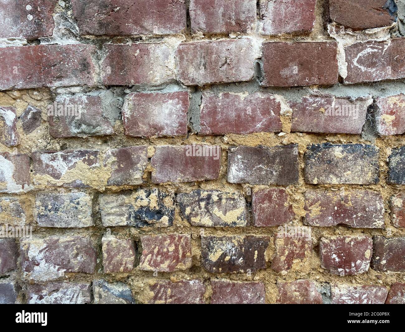 View on isolated old brick wall with cement Stock Photo