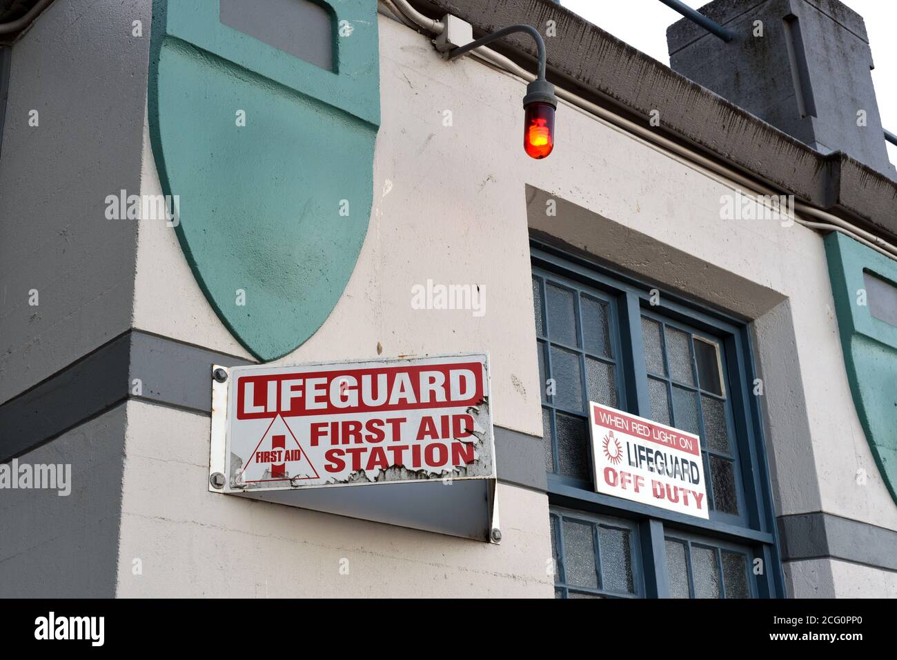 A lifeguard station at English Bay beach in Vancouver, British Columbia, Canada. A sign informs that when the red light is on, as in the photo, the li Stock Photo
