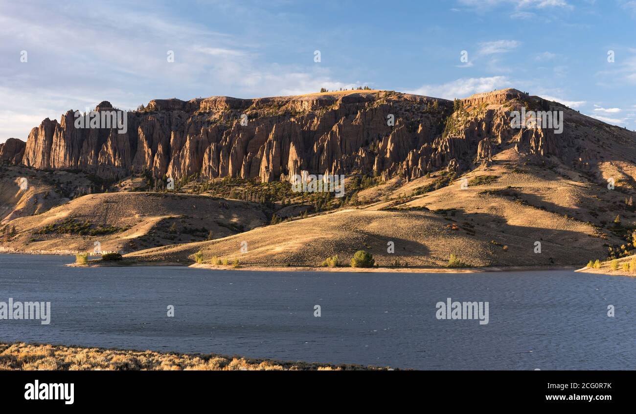 The Dillon Pinnacles rise above the Blue Mesa Reservoir in southwestern Colorado. Curecanti National Recreation Area has many recreation activities. Stock Photo