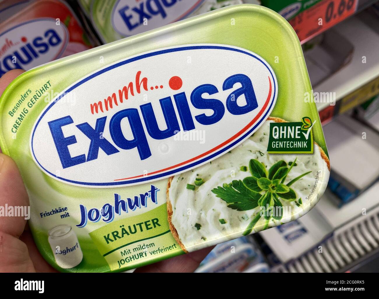 of 9. supermarket (focus Exquisa in spread german in hold Alamy Photo Viersen, on View - by Germany July shelf 2020: - cheese front Stock hand packet packet on
