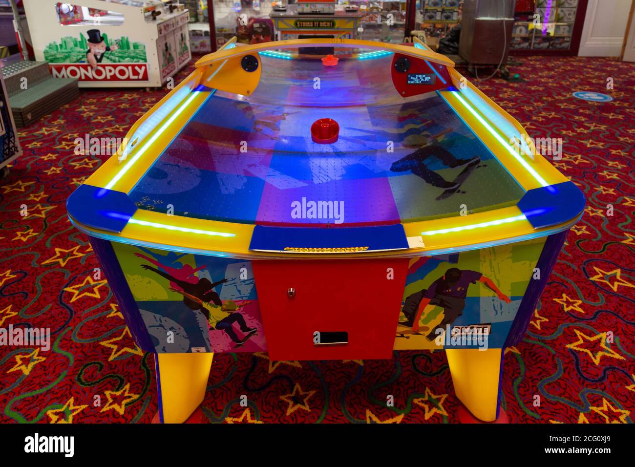 An air hockey table without players in the inside of an amusement
