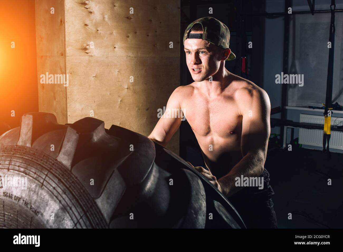 Man flipping tire hi-res stock photography and images - Alamy