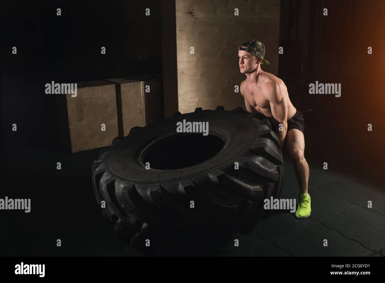 Man flipping tire hi-res stock photography and images - Alamy