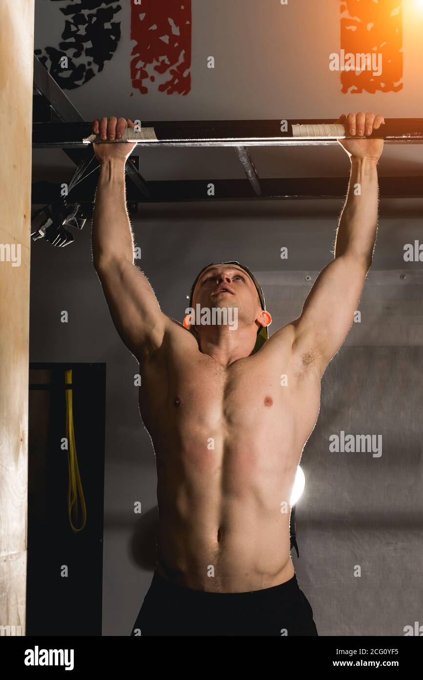 man pullups bars workout exercise at gym Stock Photo Alamy