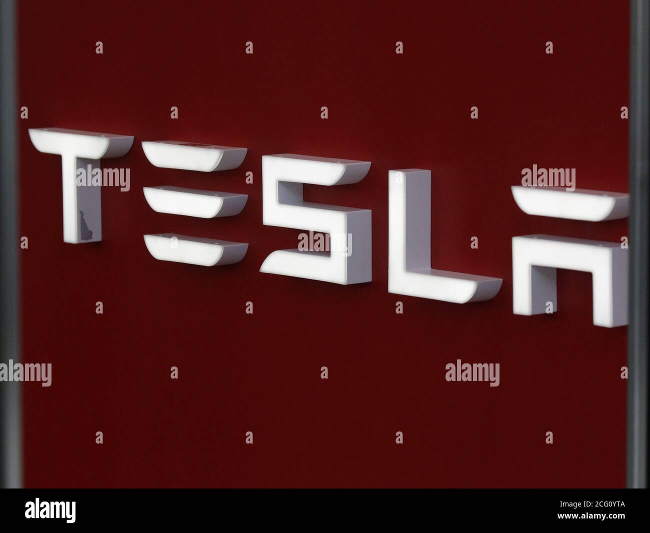 New York, United States. 08th Sep, 2020. A Tesla sign hangs at the entrance to a Tesla dealership on Tuesday September 8, 2020. Tesla shares have been falling since the electric vehicle maker was left out of the S&P 500 as a new addition to the index. Photo by John Angelillo/UPI Credit: UPI/Alamy Live News Stock Photo