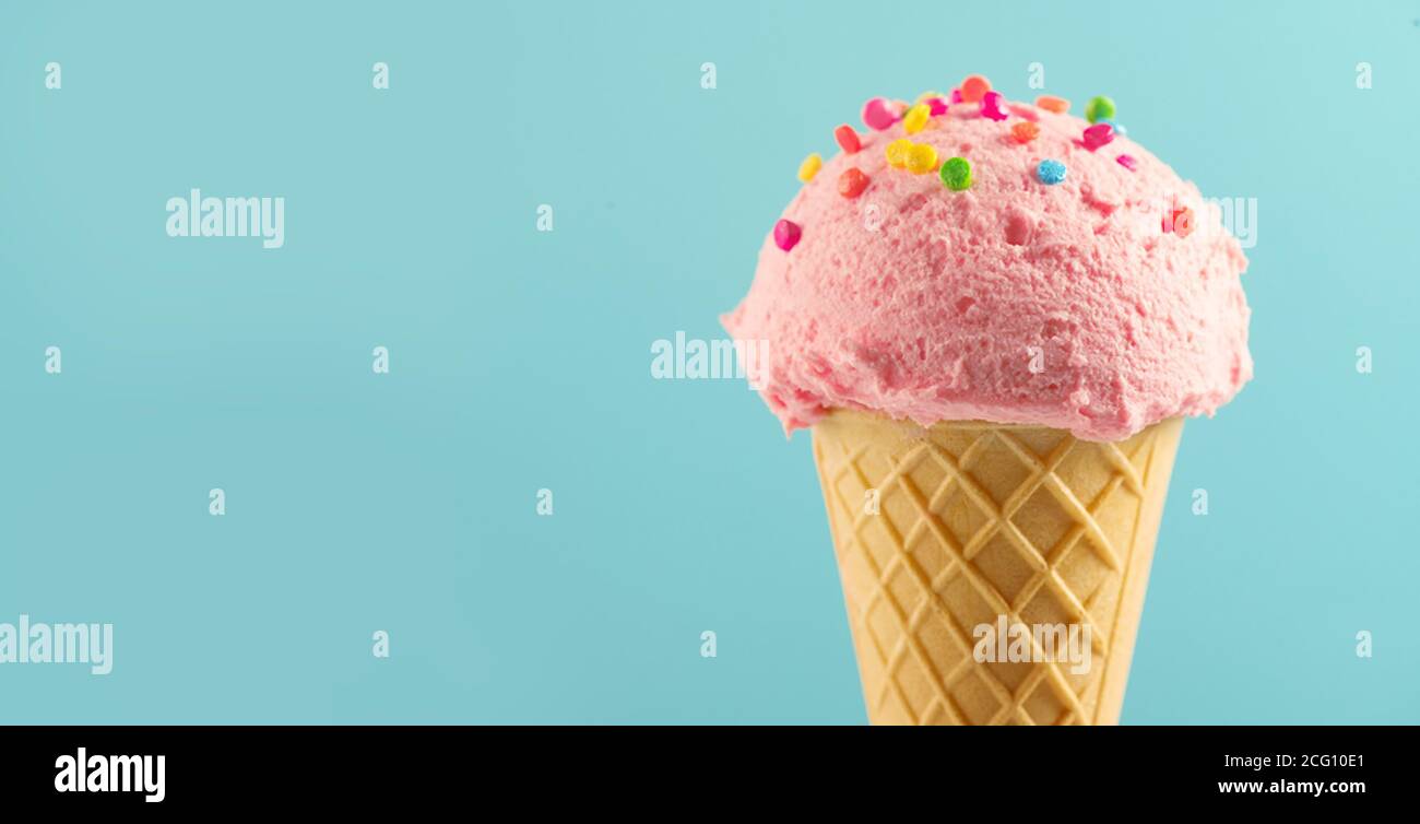 Ice cream cone close-up. Pink Icecream scoop in waffle cone Stock Photo