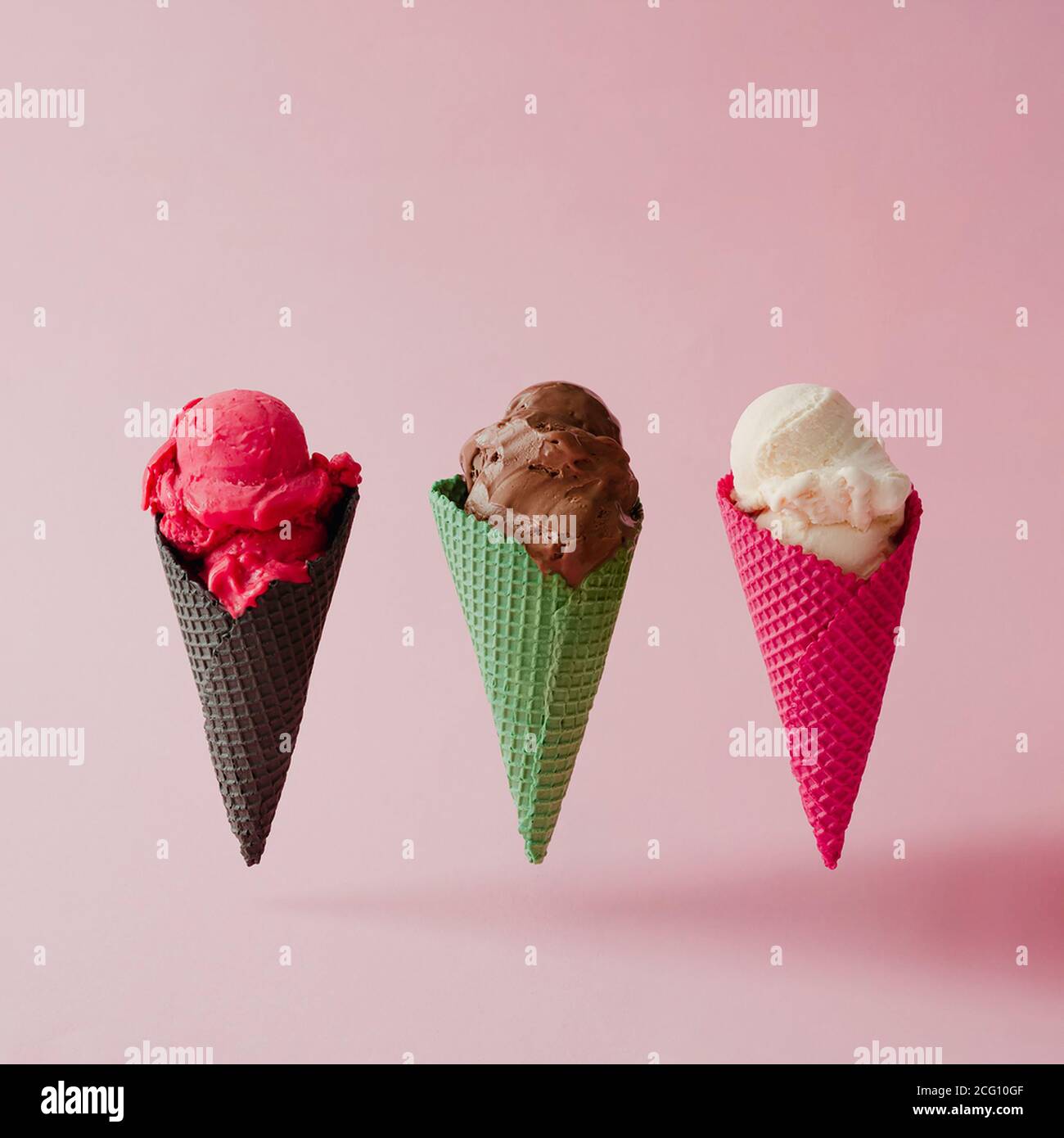 Various ice cream on pink pastel background. Summer creative concept. Stock Photo