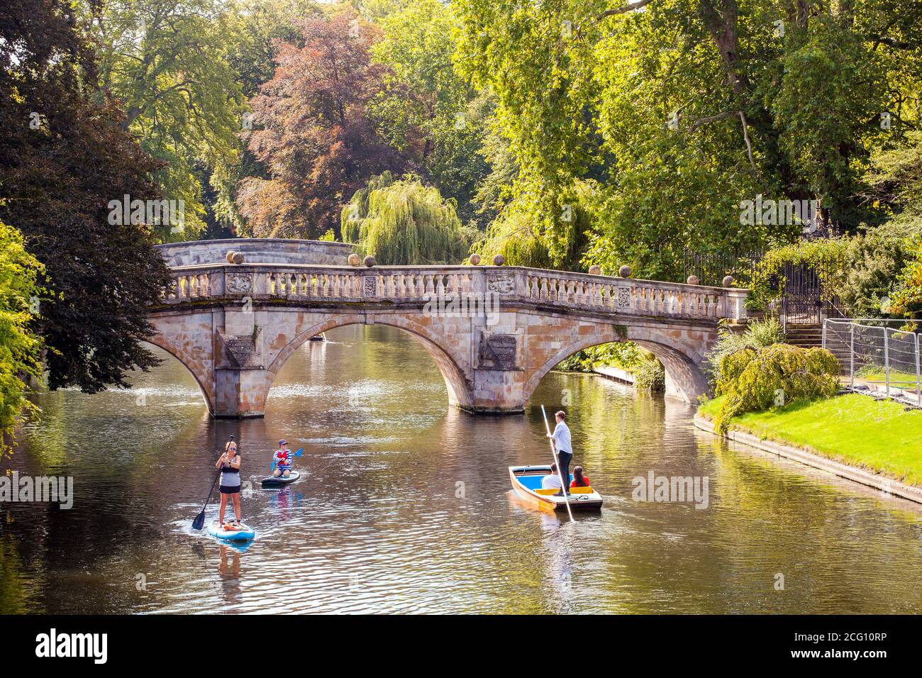 People and families punting on the river Cam by the Clare College Bridge   in the Cambridgeshire city of Cambridge England Stock Photo