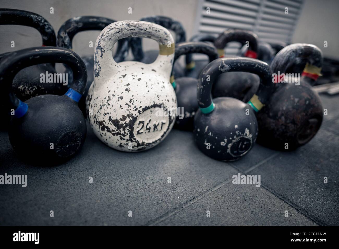 Sport equipment in gym. Kettlebell on floor background. Fitness training. Stock Photo