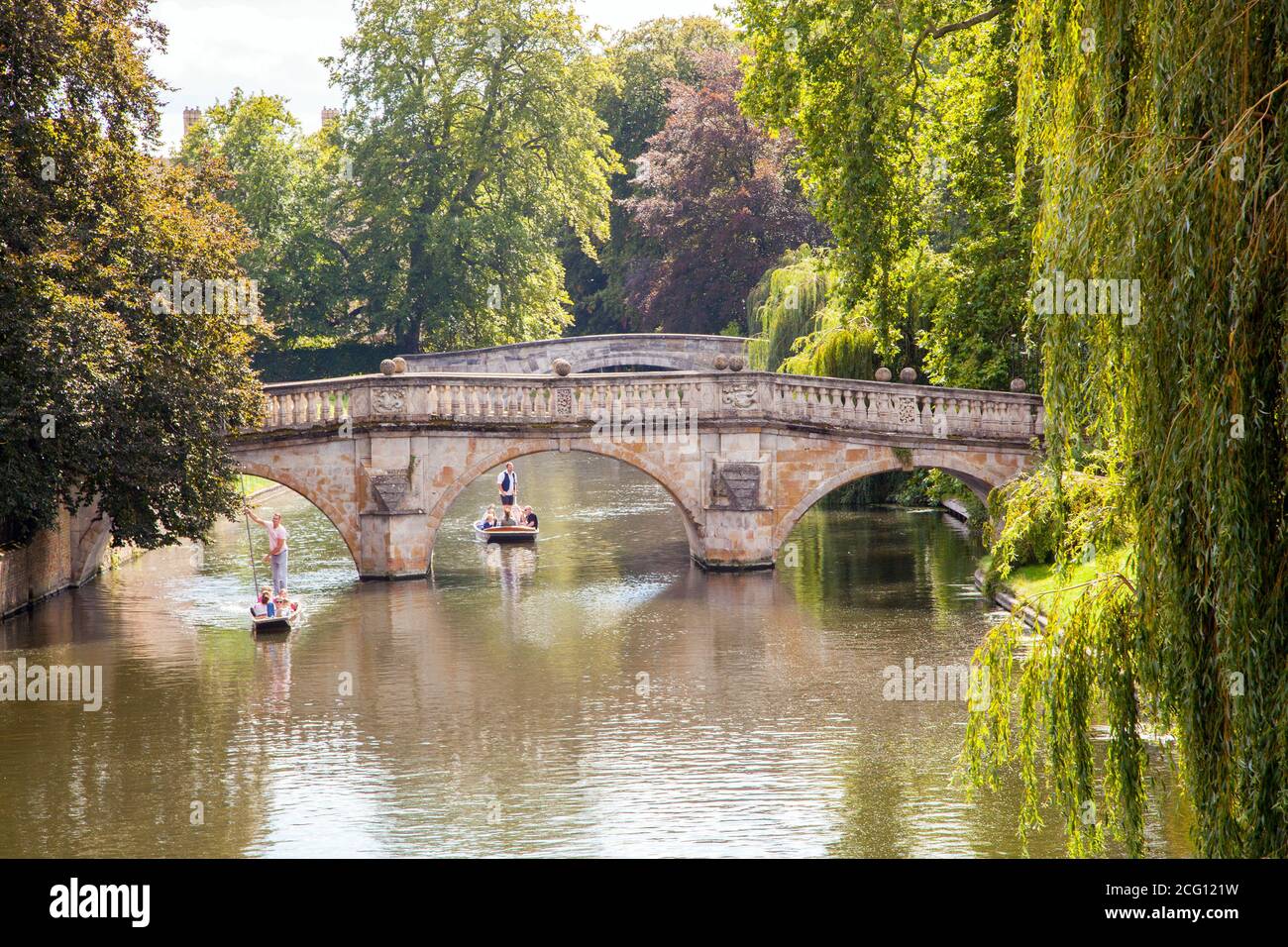 People and families punting on the river Cam by the Clare College Bridge   in the Cambridgeshire city of Cambridge England Stock Photo