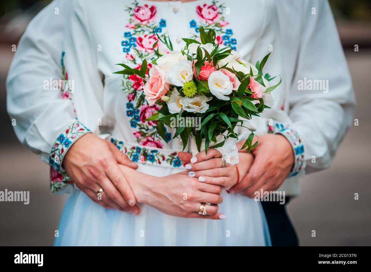 wedding bouquet in the hands of the bride of white and pink roses Stock ...