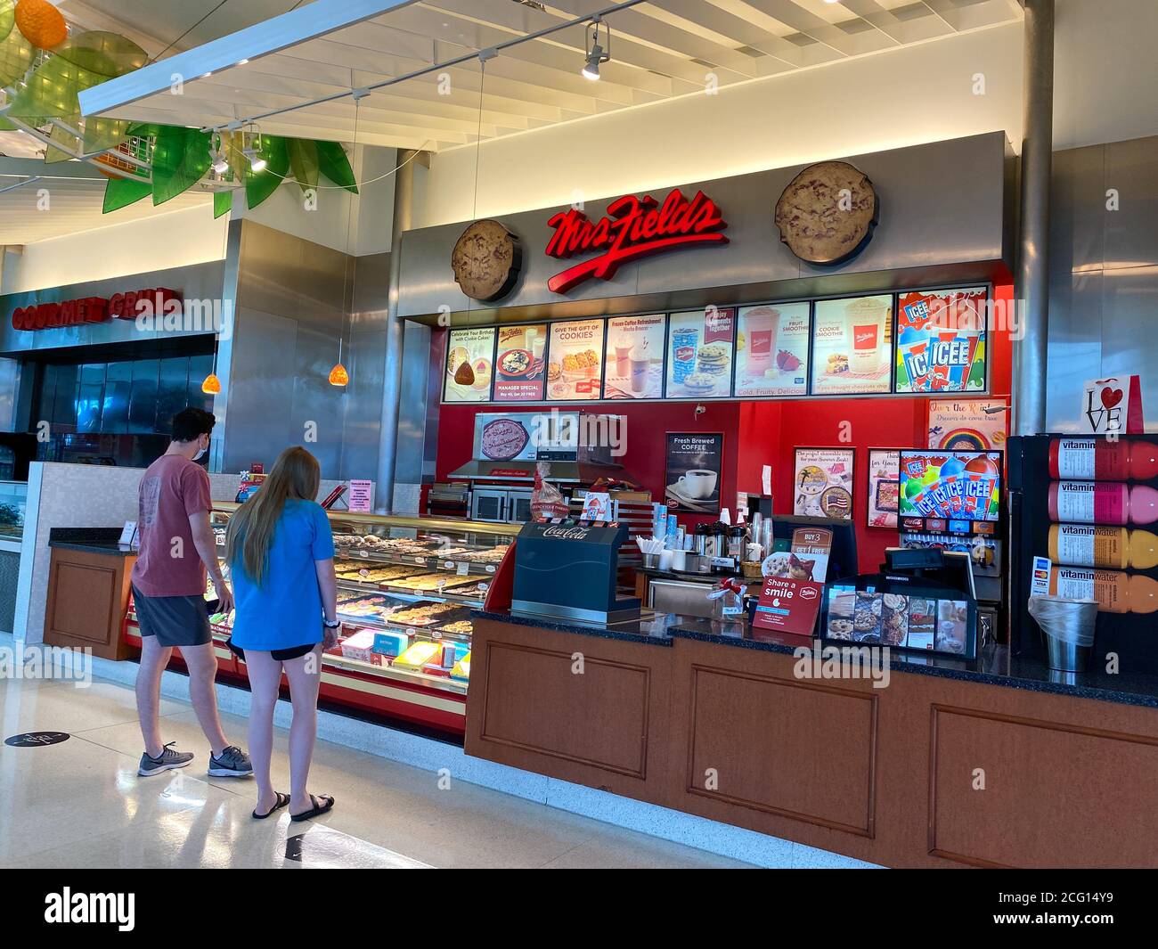 Orlando, FL/USA - 7/4/20:  People buying cookies at a Mrs. Fields Cookie retail store at an indoor mall in Orlando, Florida. Stock Photo