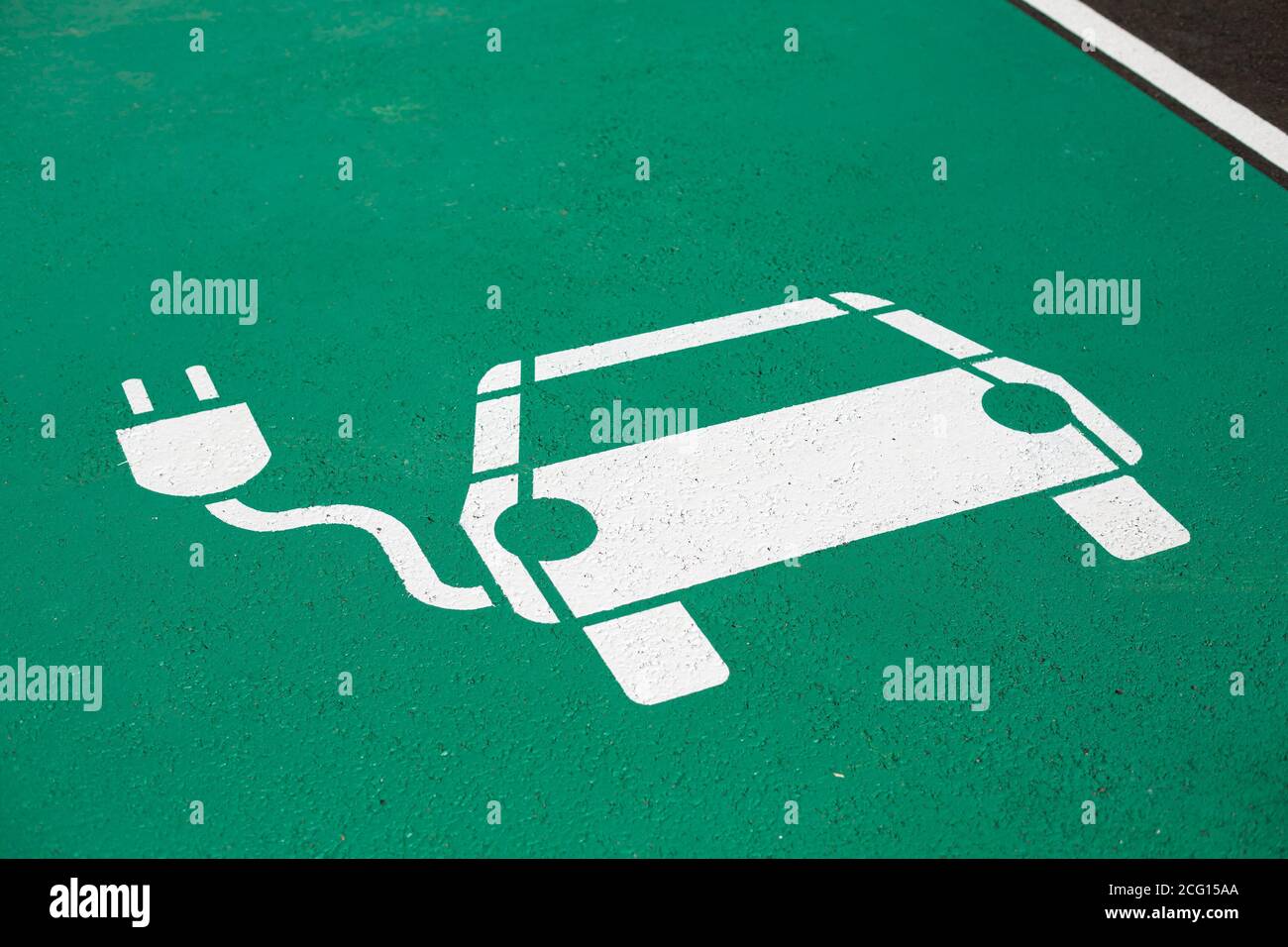 Parking symbol on the street for electric cars being charged Stock Photo