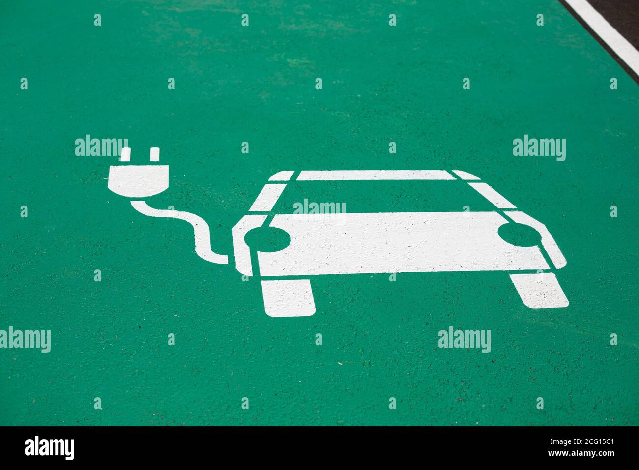 Parking symbol on the street for electric cars being charged Stock Photo