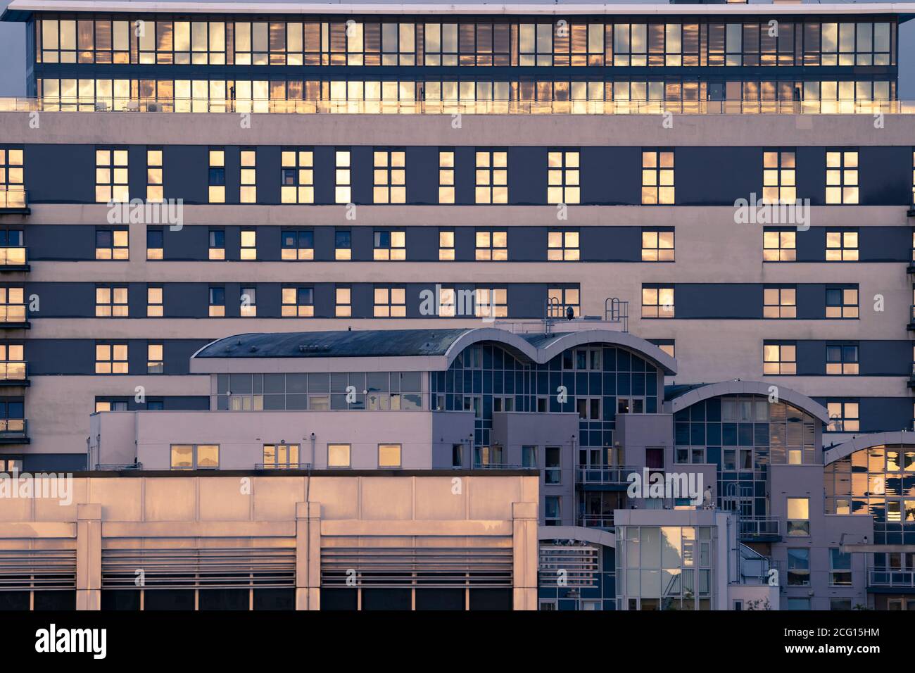 Skyline Plaza and Crown Heights high rise flats with the setting sun