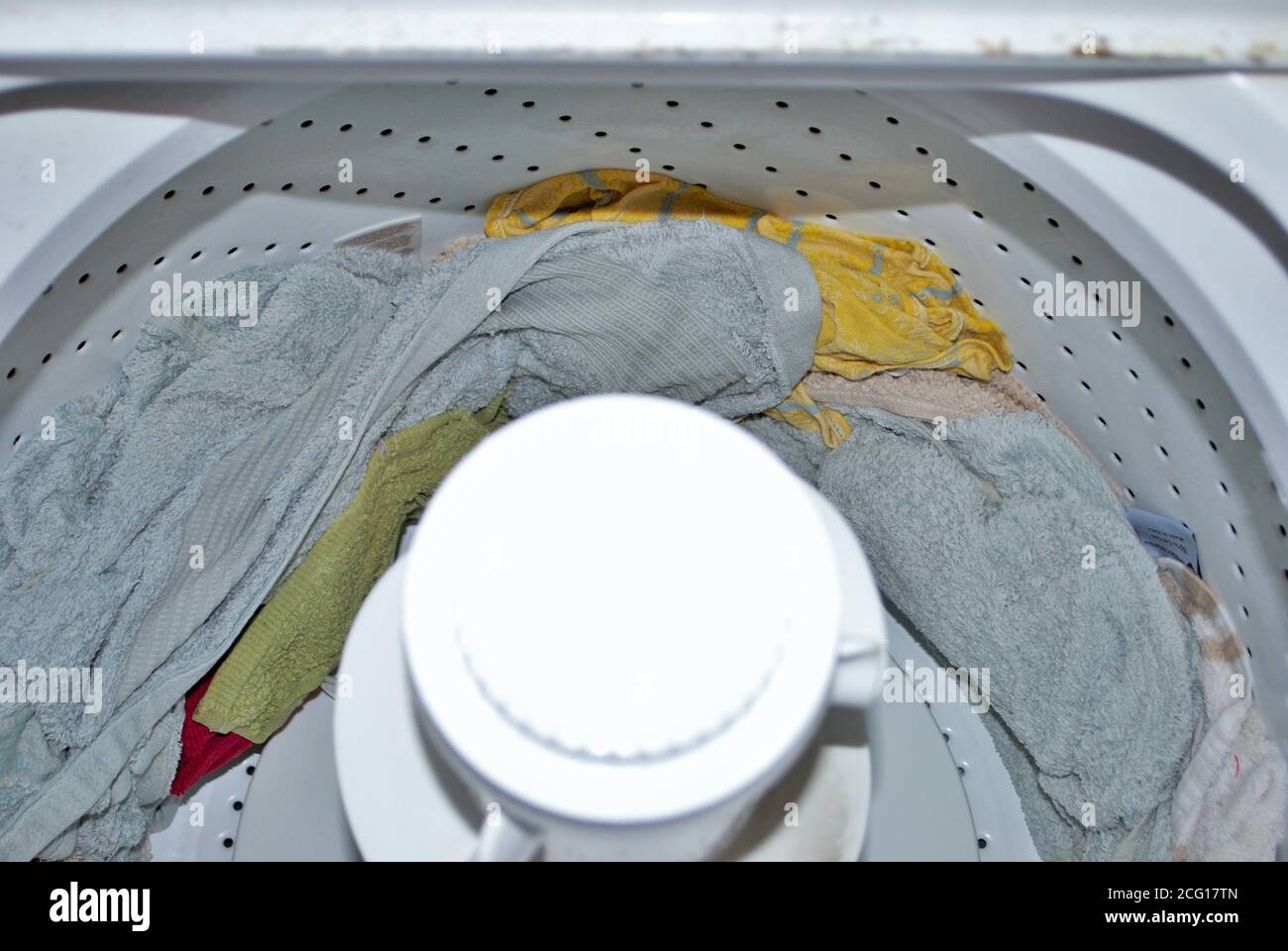 load of towels in a washing machine after the wash cycle is finished