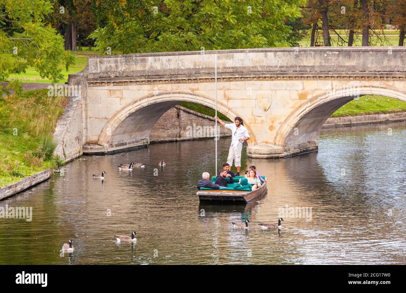 People and families punting on the river Cam in the Cambridgeshire city of Cambridge England Stock Photo