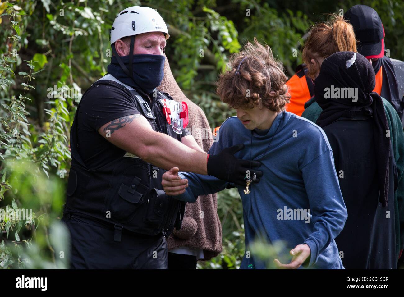 Denham, UK. 7th September, 2020. National Eviction Team enforcement agents try to prevent activists from HS2 Rebellion from interrupting tree cutting in conjunction with the HS2 high-speed rail link in Denham Country Park. Anti-HS2 activists continue to try to prevent or delay works on the controversial £106bn project for which the construction phase was announced on 4th September from a series of protection camps based along the route of the line between London and Birmingham. Credit: Mark Kerrison/Alamy Live News Stock Photo