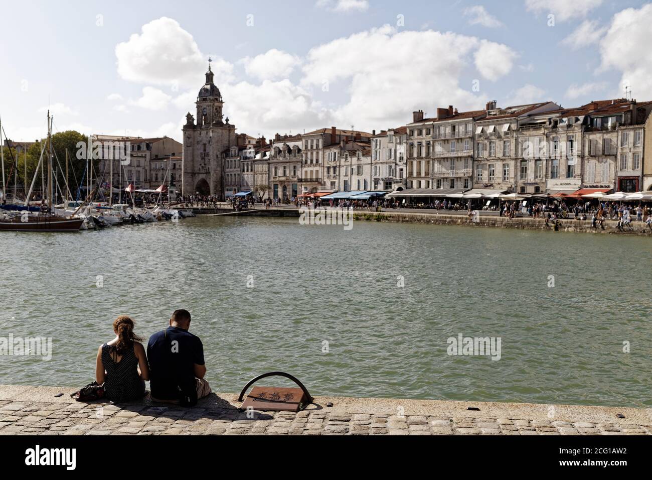 La Rochelle, France. 21st Aug, 2020. Town Clock in the old harbour of ...