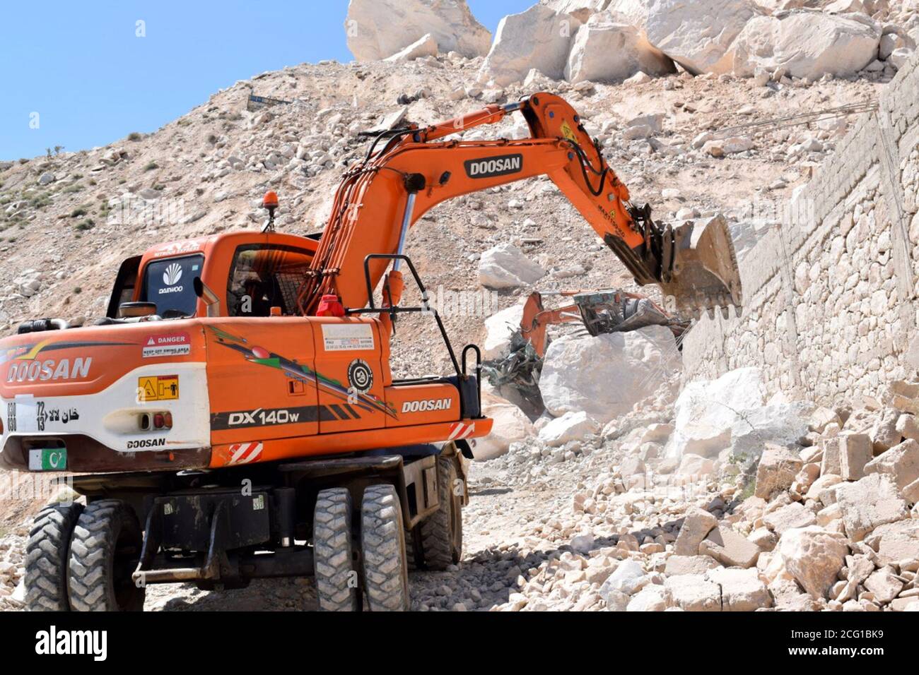 Mohmand, Pakistan. 8th Sep, 2020. Excavators are used to search for miners after a rock slide at a marble mine in Pakistan's northwest tribal district of Mohmand, on Sept. 8, 2020. The death toll from the rock slide incident at a marble mine, which took place on Monday in Pakistan's northwest tribal district of Mohmand, climbed to 19, police and local media said on Tuesday. Credit: Str/Xinhua/Alamy Live News Stock Photo