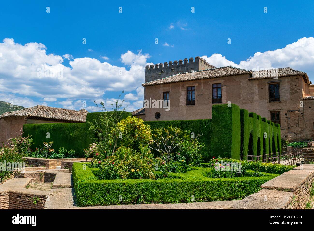 Alhambra Palace Arch-shaped hedge courtyard - Granada, Spain Stock Photo