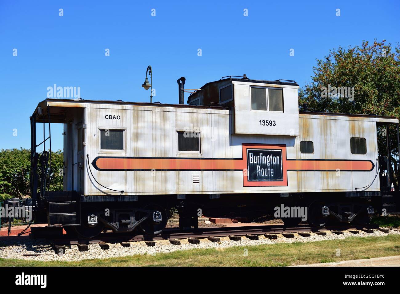 Princeton, Illinois, USA. An old Chicago Burlington & Quincy Railroad caboose or way car preserved on the grounds by the Amtrak depot in Princeton. Stock Photo