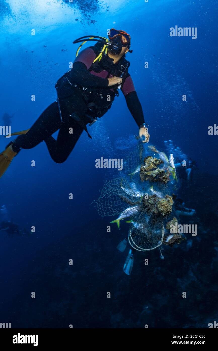 ghost net scuba diver reef conservation Stock Photo
