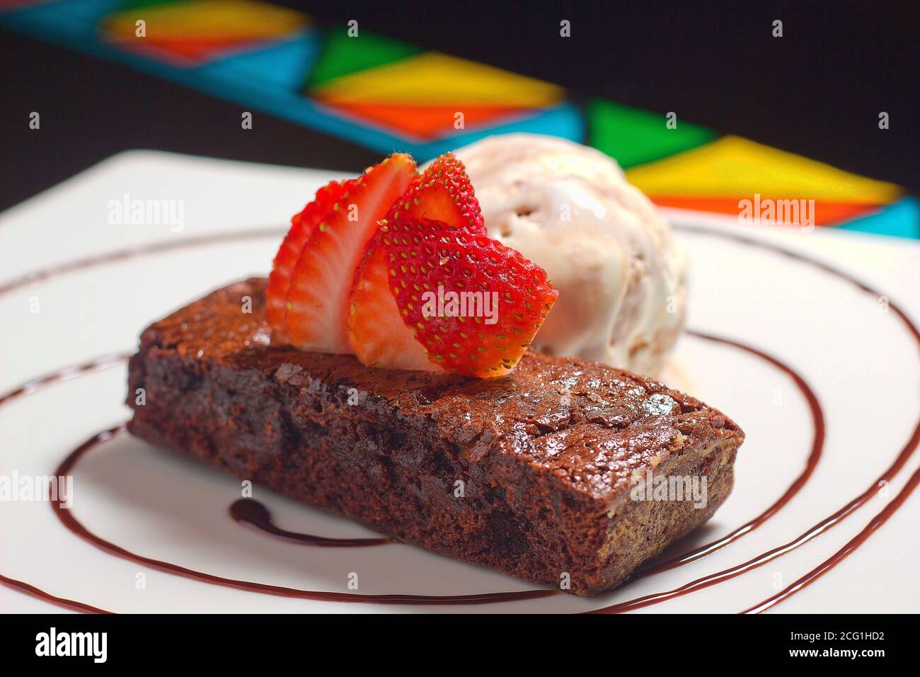 Brownie with ice cream and strawberries delicious. High quality photo Stock Photo