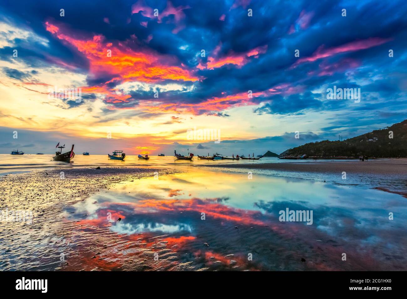 thailand beach sunset with boats and people. High quality photo Stock Photo