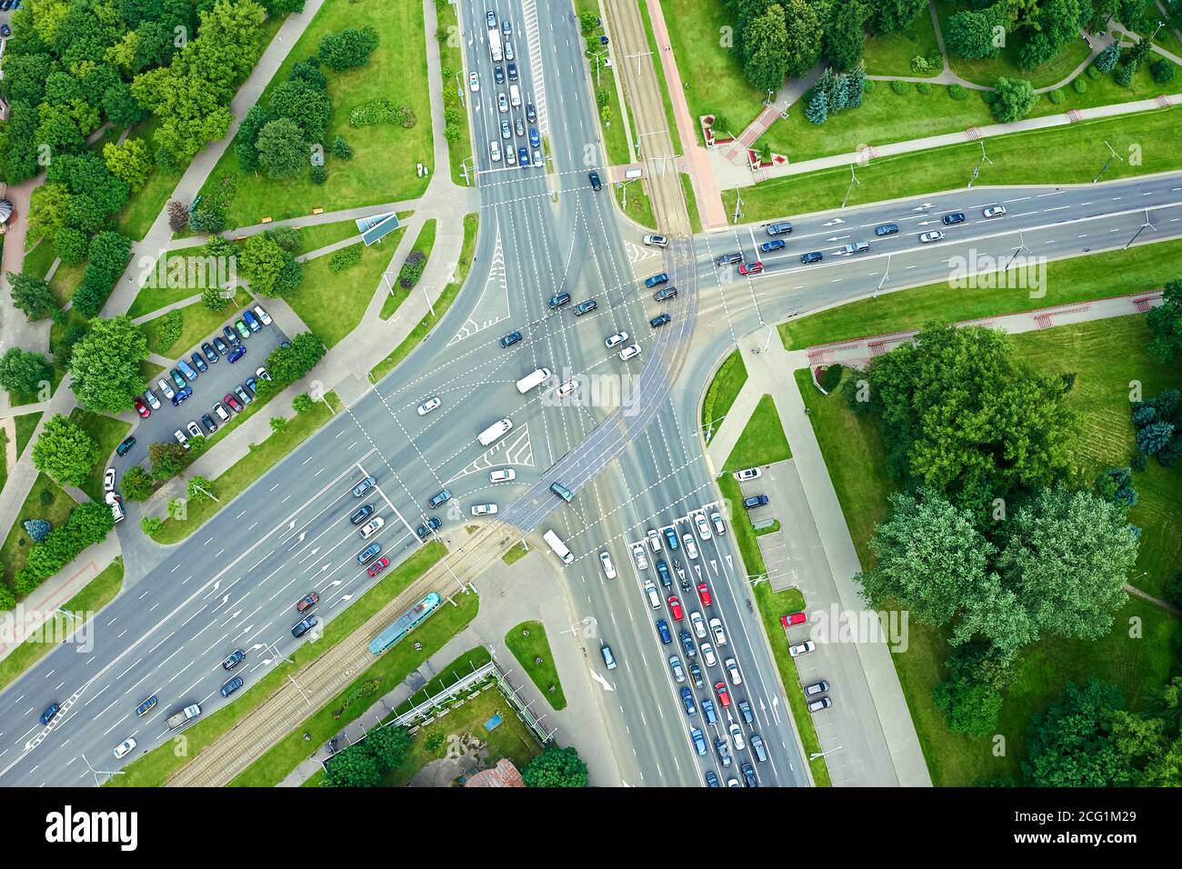 aerial top view of a crossroad junction in city with busy car traffic Stock Photo