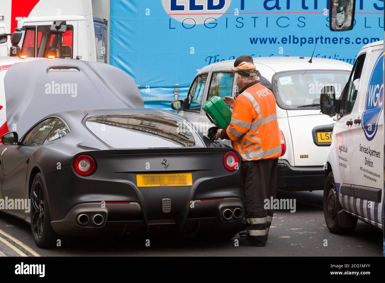 https://c8.alamy.com/comp/2CG1MYY/ferrari-f12-causing-a-traffic-jam-outside-the-national-portrait-gallery-charing-cross-road-london-after-running-out-of-fuel-charing-cross-road-london-uk-15-nov-2017-2CG1MYY.jpg