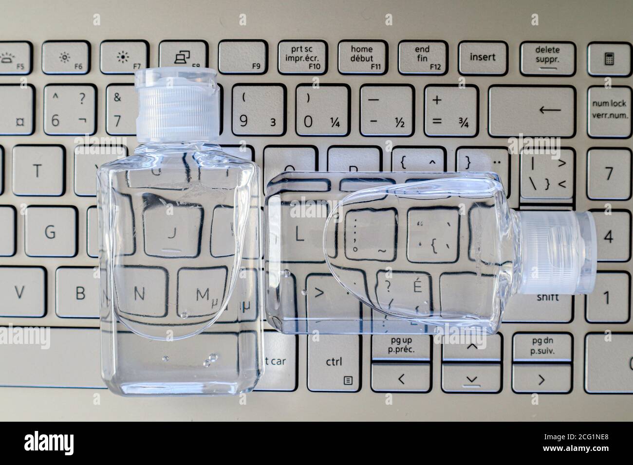 Hand Sanitizer on laptop keyboard Back to office concept Stock Photo