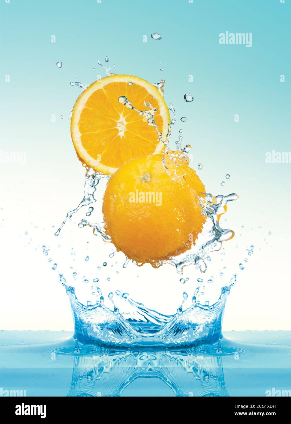 Orange slice with splashing water Stock Photo - Alamy