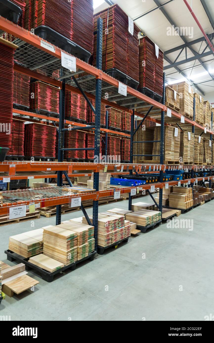 Exotic woods are stacked while awaiting assembly to make guitars in the