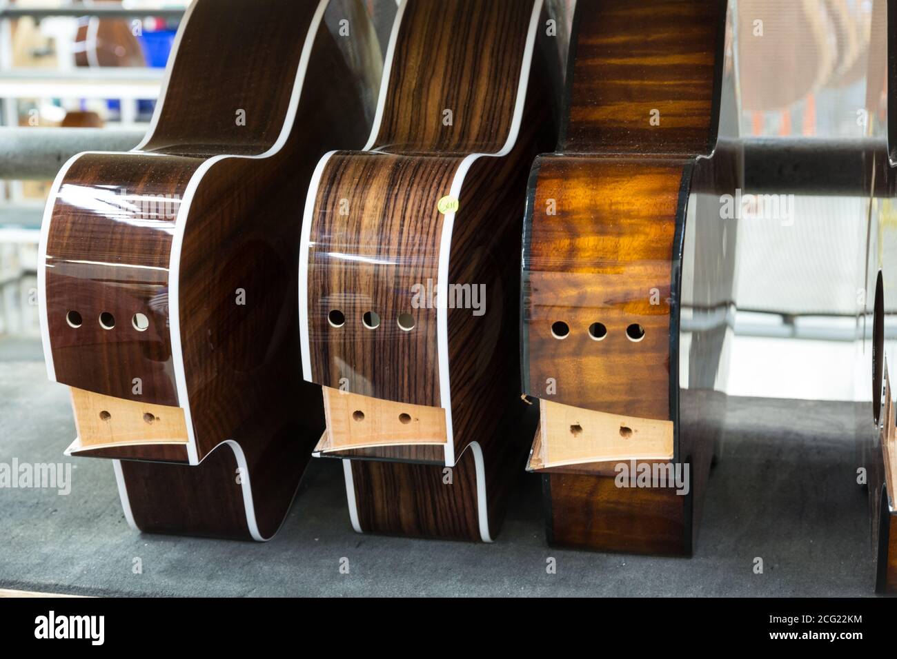Partially finished guitar bodies in the assembly line at the Taylor