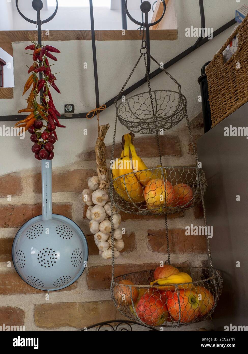 Detail of kitchen in vintage style. Hanging fruits and vegetables Stock