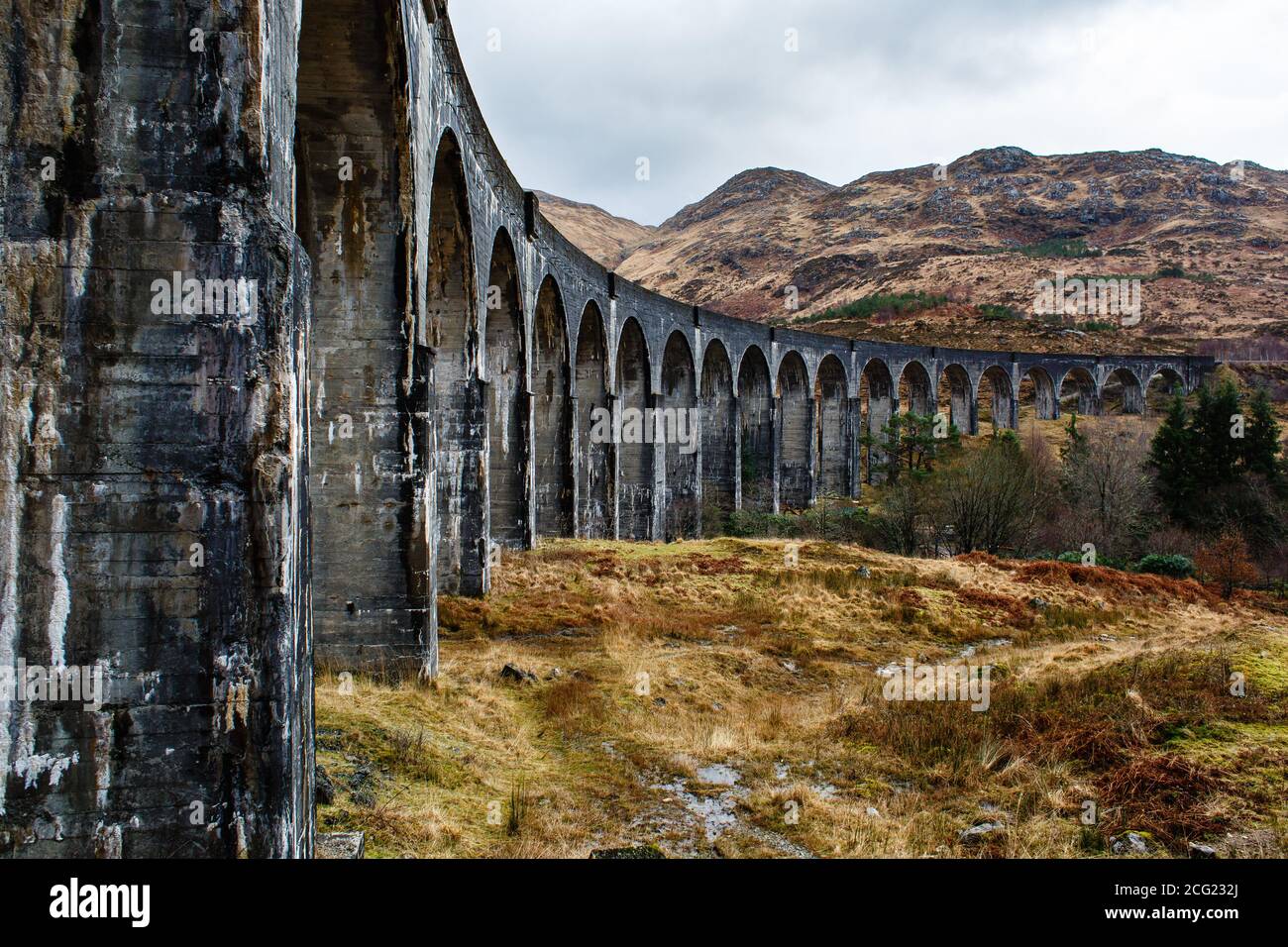 Glenfinnan train viaduct in a cloudy, rainy weather, Scotland Stock