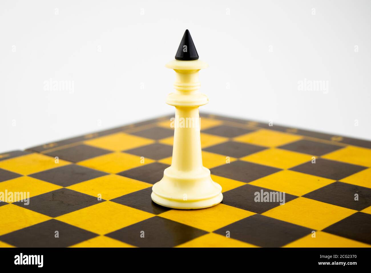 Premium AI Image  A yellow background accentuates the presence of chess  pieces and the board Vertical Mobile Wallpaper