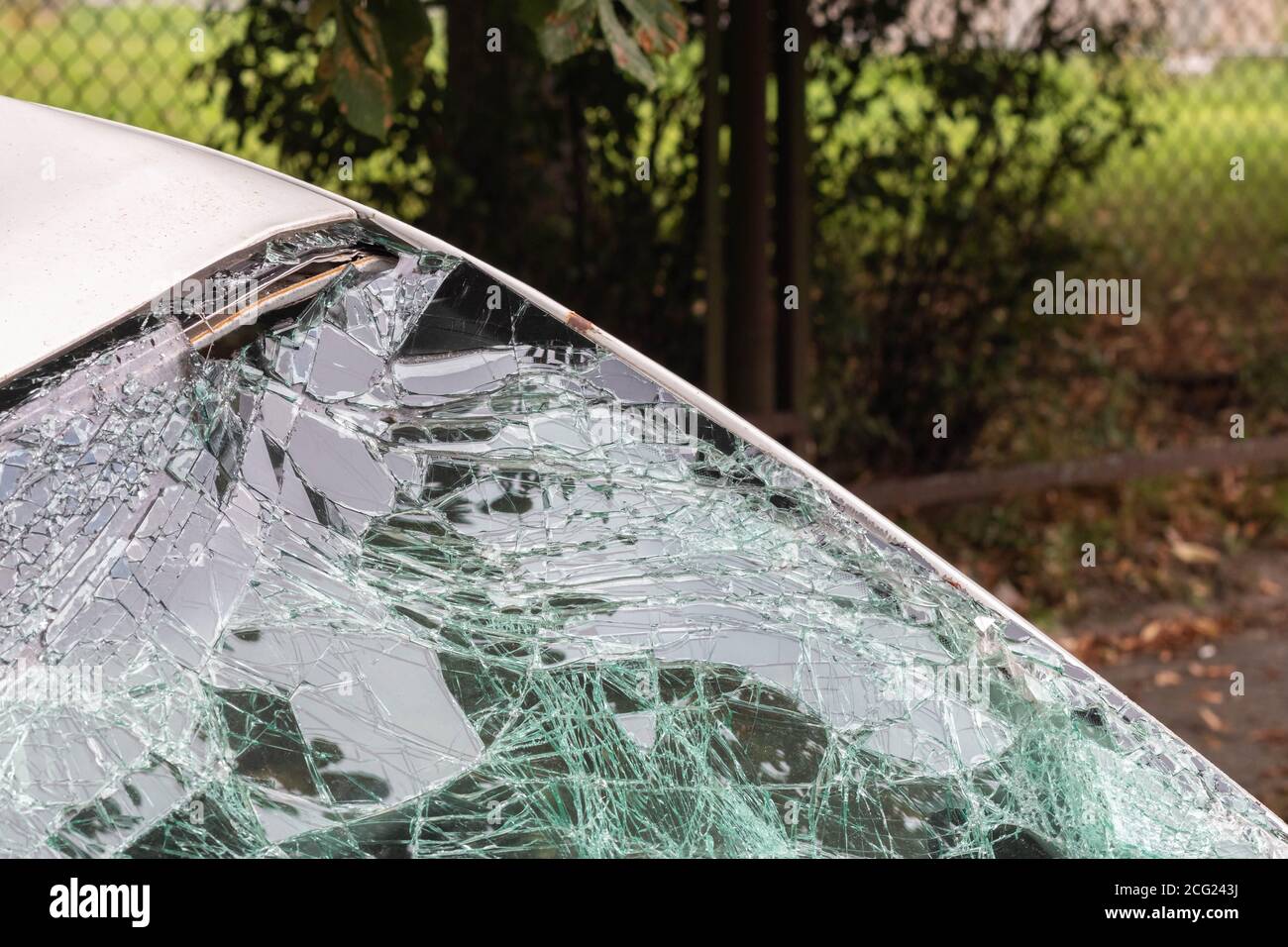 White car with broken windshield close up. Selective focus. Accident on road. Car insurance concept Stock Photo