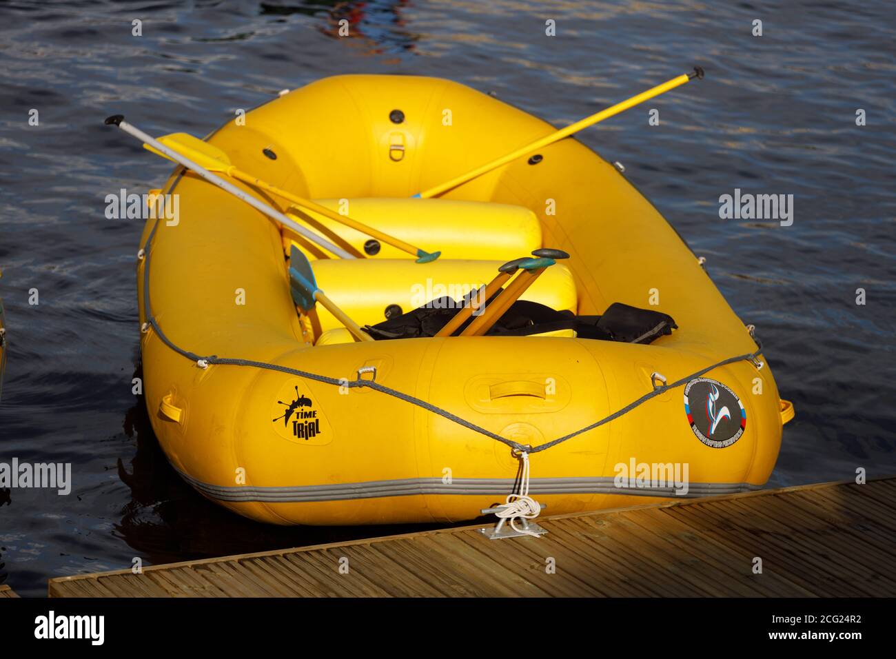 yellow inflatable boat with oars on the pier Stock Photo Alamy