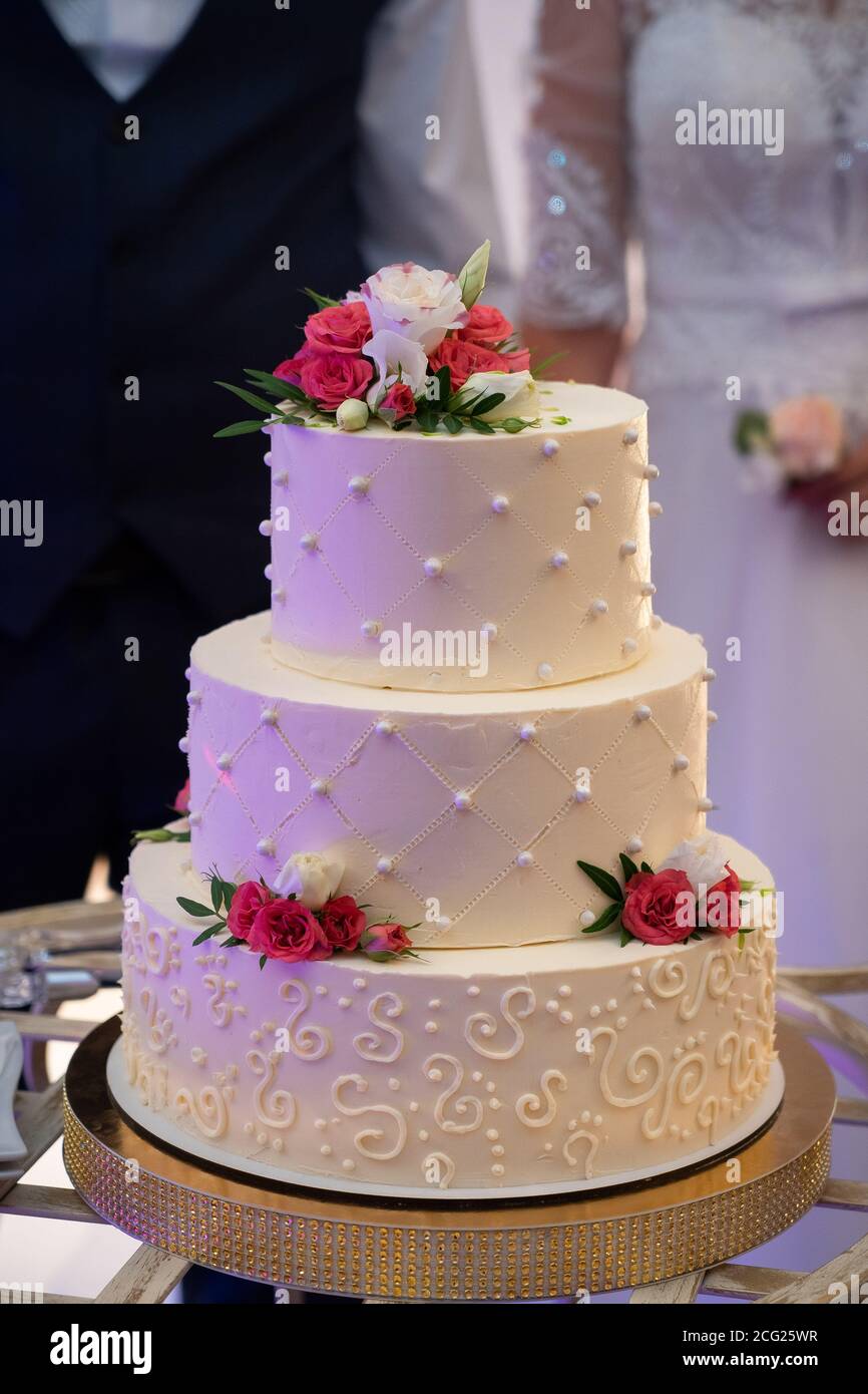 Wedding cake, hands and the knife, cutting Stock Photo
