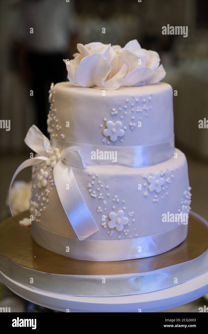 Wedding cake, hands and the knife, cutting Stock Photo