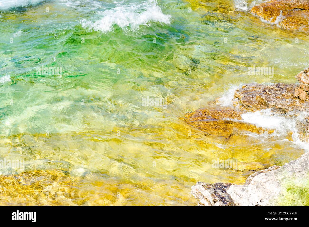 Waves hitting the shore as seen from above. Impressionism. Stock Photo