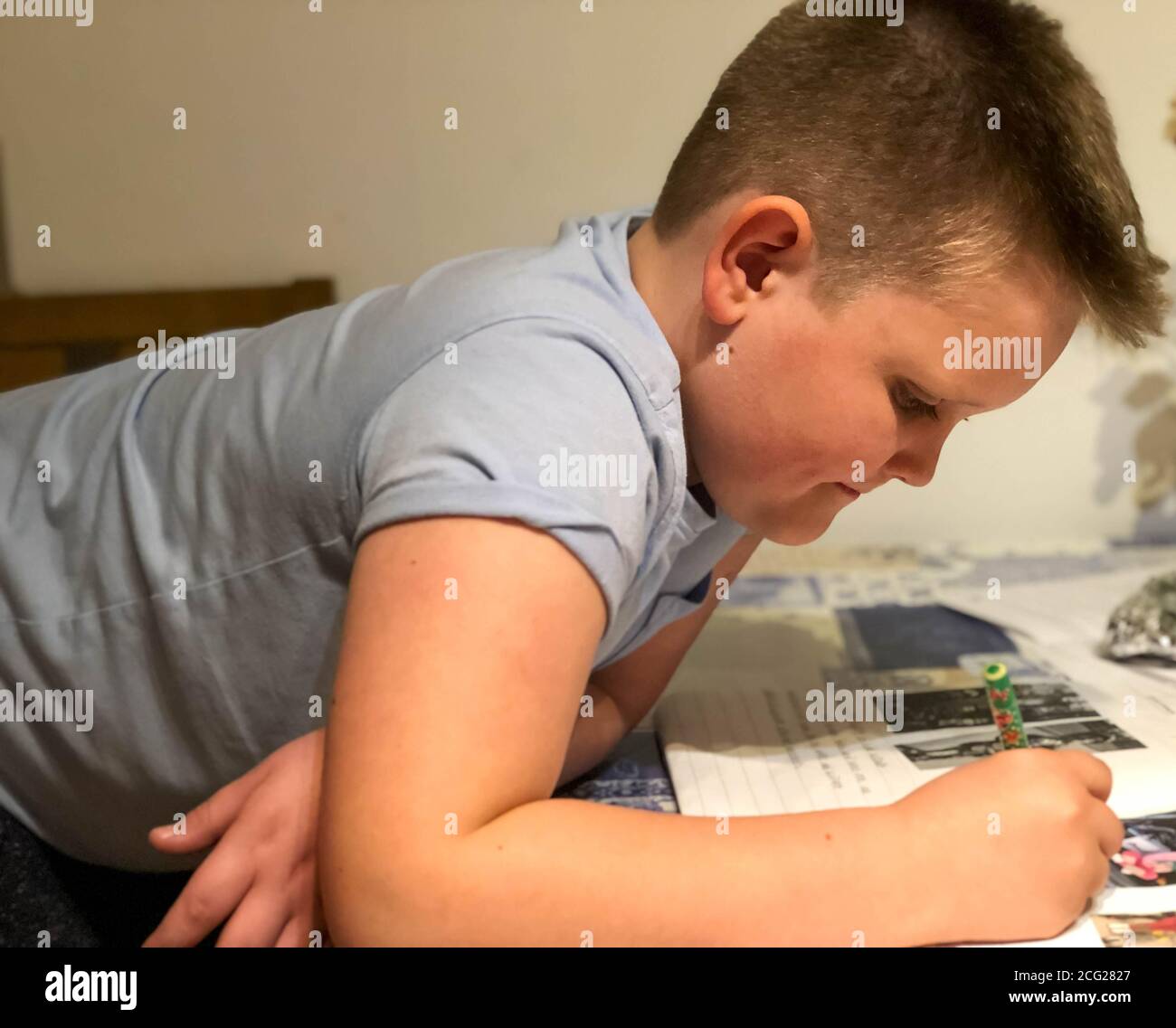 learning boy because he wants to be important when he grows up Stock Photo