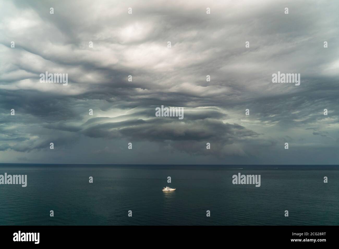 Clouds gather over the sea before a thunderstorm near the coast in Crimea . Stock Photo