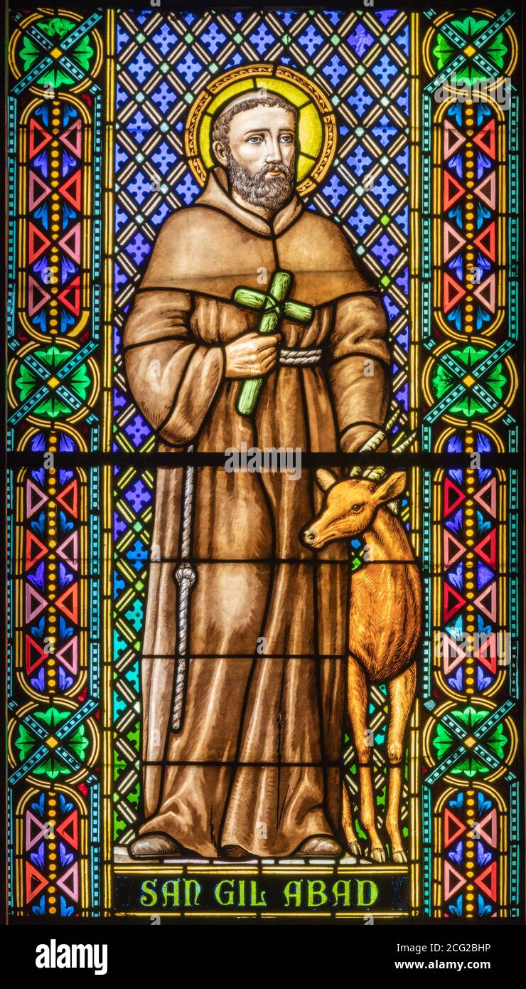 BARCELONA, SPAIN - MARCH 3, 2020: The Saint Gil Abad on the windowpane in the church Parroquia de la Mare de Deu de Nuria. Stock Photo