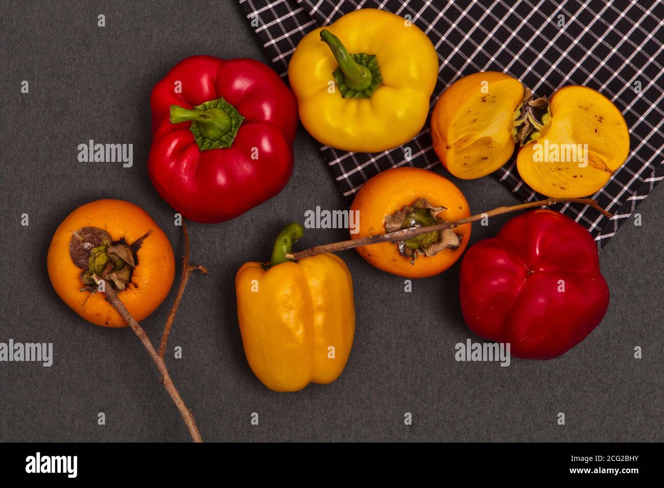 peppers and persimmons Stock Photo