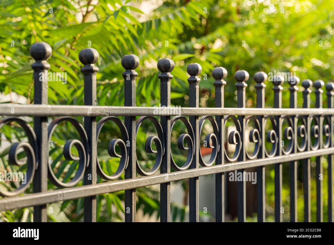 Beautiful decorative cast metal wrought fence with artistic forging ...